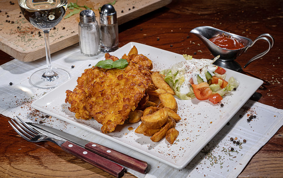 Piept de pui in fulgi de porumb